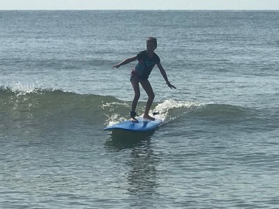 a man riding a wave on a surfboard in the ocean