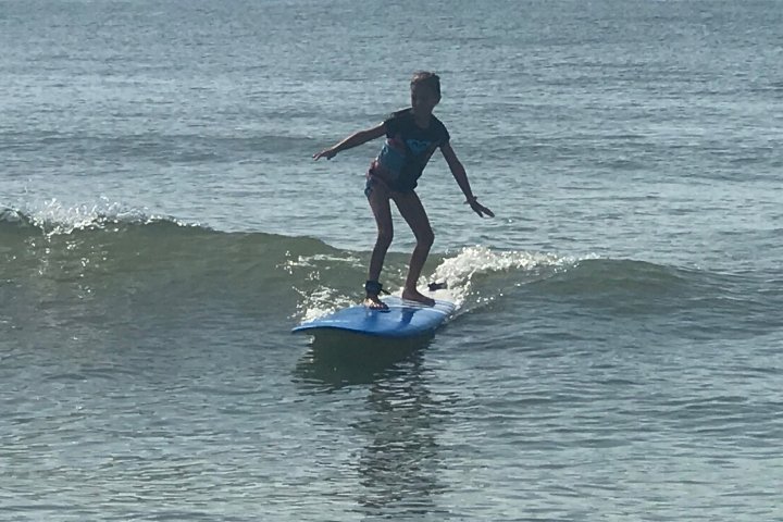 a man riding a wave on a surfboard in the ocean