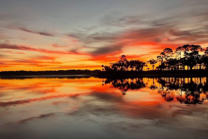 a sunset over a body of water