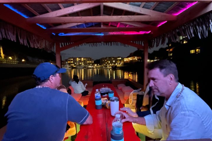 a group of people sitting at a table in a restaurant
